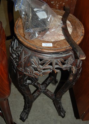 Lot 700A - A Chinese dark wood urn stand, late Qing...