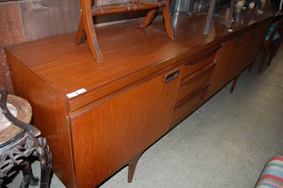 Lot 701 - A mid 20th century teak dining room suite,...