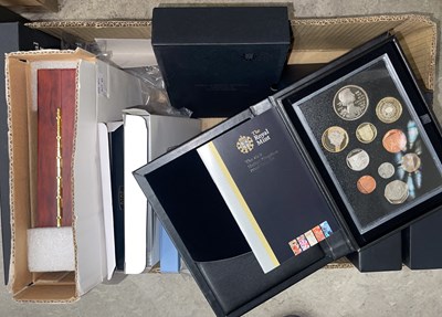 Lot 711 - A box of assorted boxed Royal Mint coin sets,...
