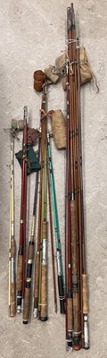 Lot 727 - A collection of nine assorted fishing rods;...