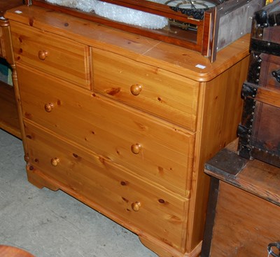 Lot 706 - A modern pine chest of two short over two long...