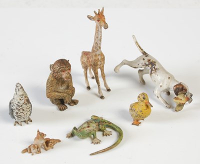 Lot 384 - A collection of seven miniature cold painted...