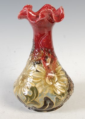 Lot 608A - A late 19th century art pottery slip glazed...