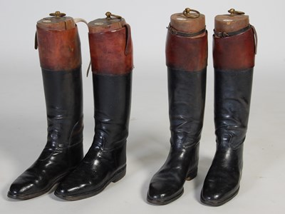 Lot 204 - Two pairs of black and tan leather riding...