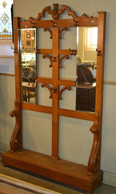 Lot 712 - A late 19th century oak hall stand, the top...