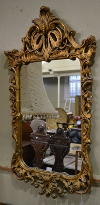 Lot 714 - A 20th century Rococo style wall mirror,...