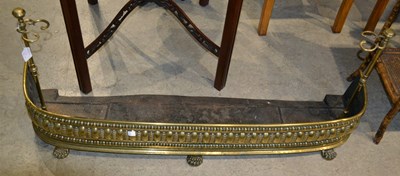 Lot 723 - A 19th century brass fireplace fender with...