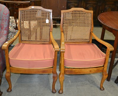 Lot 749 - A pair of 20th century beechwood Bergere...