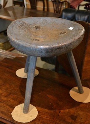 Lot 729 - A 19th century primitive stool raised on three...