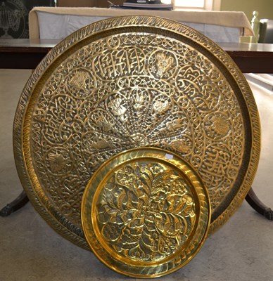 Lot 783 - A large Middle Eastern brass table top with...