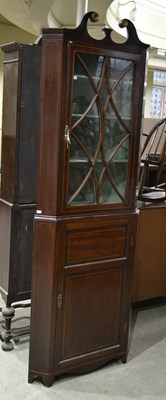 Lot 777 - A 19th century mahogany corner cabinet with...