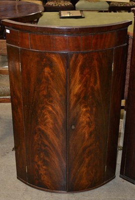Lot 806 - A 19th century mahogany corner cupboard,...
