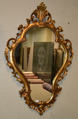 Lot 682 - A 20th century cartouche shaped gilded wall...