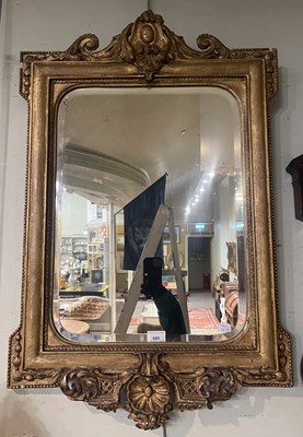 Lot 685 - A 19th century gilt wall mirror featuring...