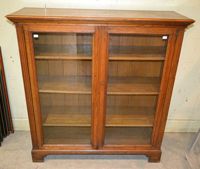 Lot 835 - An early 20th century oak two door bookcase...