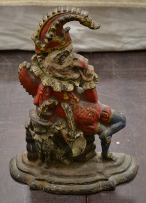 Lot 493 - A Punch and Judy cast iron door porter raised...