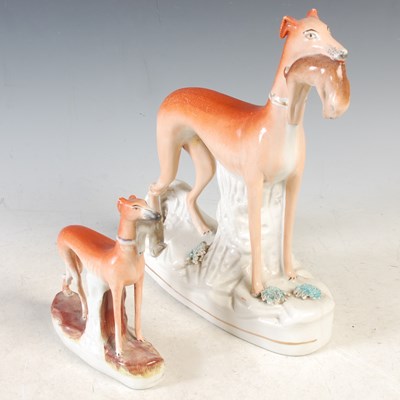 Lot 415 - A 19th century Staffordshire Greyhound figure...