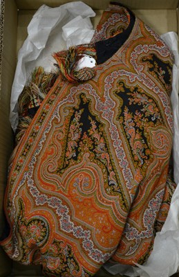 Lot 557 - An early 20th century hand woven shawl in...