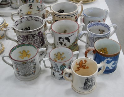 Lot 434 - A 19th century frog/ newt loving cup with two...