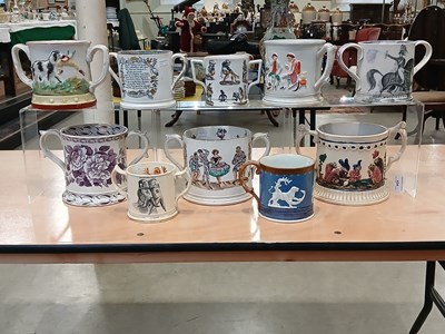 Lot 434 - A 19th century frog/ newt loving cup with two...