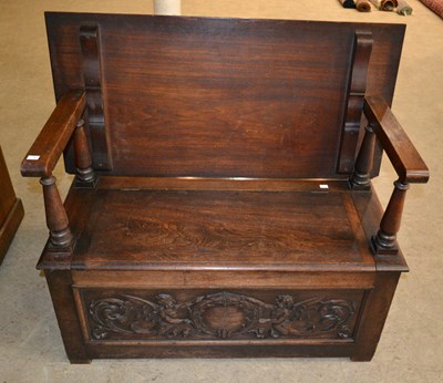 Lot 824 - A 19th century carved oak monk's bench...