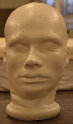 Lot 476 - A plaster cast death mask of a male figure,...