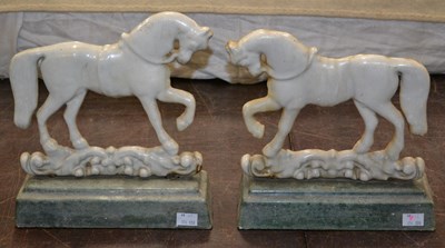 Lot 478 - A pair of cast iron door porters in the form...