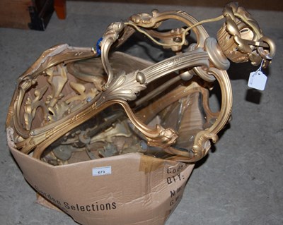 Lot 673 - A 20th century gilt metal three-light Rococo...