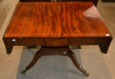 Lot 836 - A Regency mahogany sofa table, the drop flaps...
