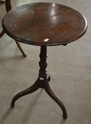 Lot 829 - A George III mahogany circular tripod wine...