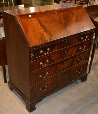 Lot 838 - A George III mahogany bureau, with brass...