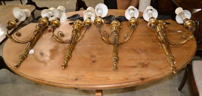 Lot 549 - A set of four Regency style gilt gesso twin...
