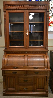 Lot 861 - A 19th century walnut cylinder bureau bookcase...