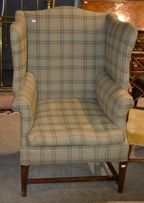 Lot 849 - A George III style library armchair in green...