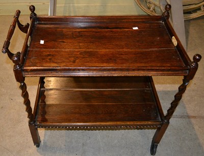 Lot 847 - A 20th century oak two tier barley twist...
