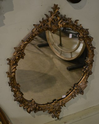 Lot 684 - A 19th century gilt gesso circular wall mirror,...