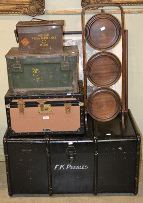 Lot 864 - A large black travel trunk with painted...