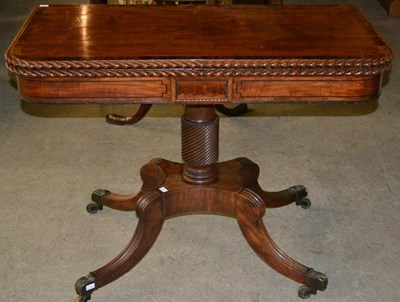 Lot 860 - A 19th century mahogany fold over tea table,...