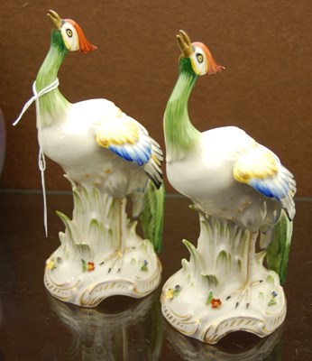 Lot 388 - A pair of porcelain phoenix bird figures...