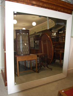 Lot 675 - A large rectangular wall mirror with graduated,...