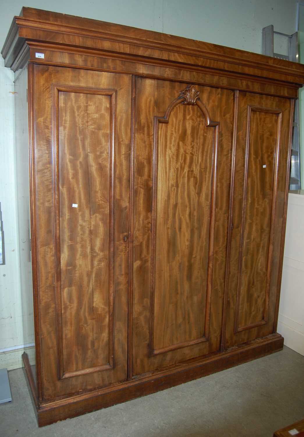 Lot 676 - A Victorian mahogany three-door wardrobe