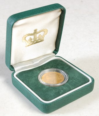 Lot 26 - A Victorian gold sovereign dated 1863 in green...