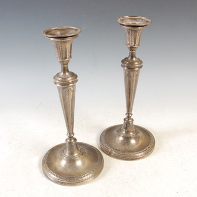 Lot 70 - A pair of George III silver candlesticks,...