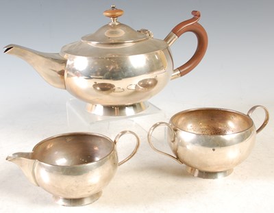 Lot 71 - An early 20th century three piece silver tea...