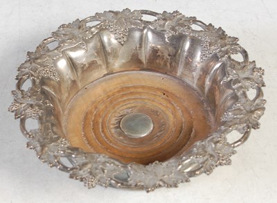 Lot 108 - A silver plated bottle stand, the rim cast...