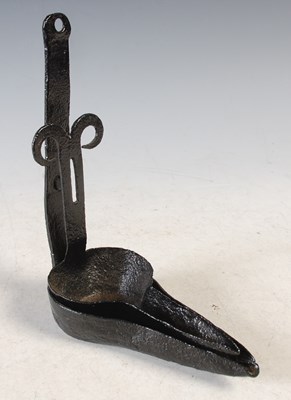 Lot 115 - An antique iron double cruise lamp, 8cm high.