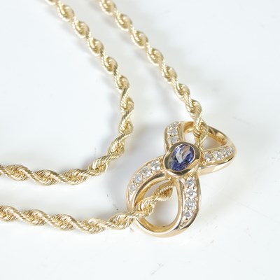 Lot 116 - A yellow metal necklace with gem set slider...