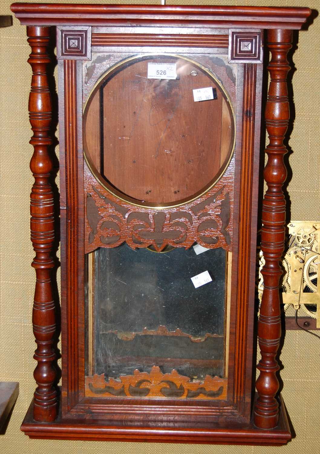 Lot 526 - A rectangular wall clock with turned wooden...