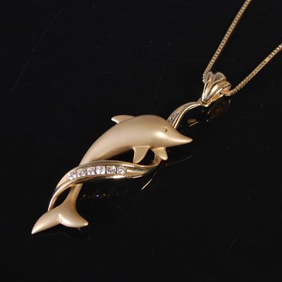 Lot 127 - A yellow metal and diamond set dolphin pendant...