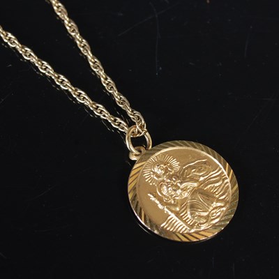 Lot 130 - A 9ct gold St Christopher pendant suspended on...